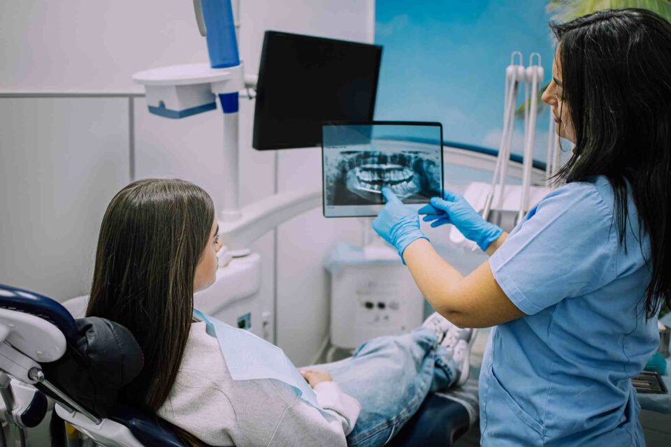 Dental X-ray review at Dental Care of Wheaton in Wheaton, IL, for oral health assessment.