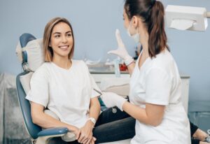 A dentist guiding a patient on the benefits of comprehensive dental treatment options in Wheaton, IL
