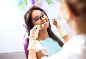 A patient during a dental check-up, promoting the impact of oral health on confidence in Wheaton, IL