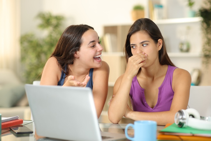 Bad breath causing awkward social interaction between two people in Wheaton, Illinois